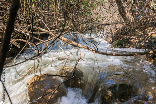 The rapid, shallow, cold mountain Ayun river in the Galilee in northern Israel