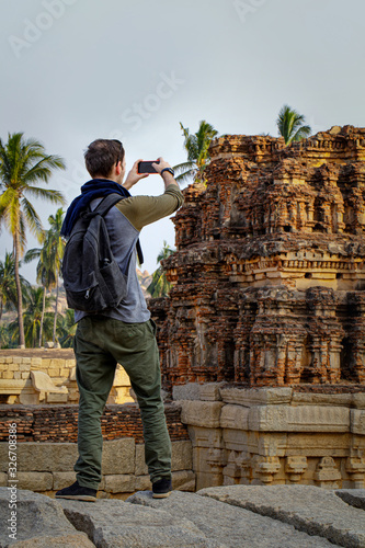 Photography Guy tourist shoots a photos of tourist attractions