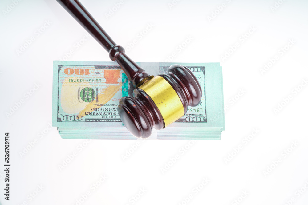 Gavel hammer and banknote with white background Gavel hammer and banknote with white background
