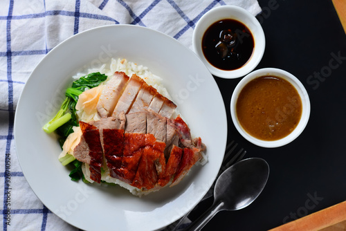 Rice roasted duck and crispy skin pork belly with gravy sauce photo