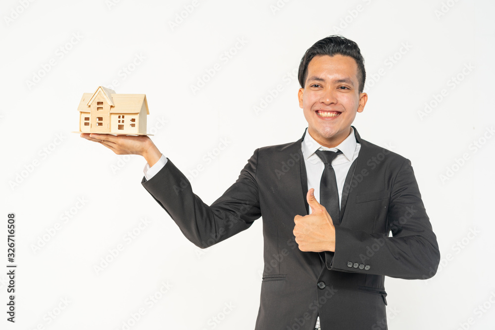 Businessman house agent with investment concept. Focused at house wood model. Businessman house agent with investment concept. Focused at house wood model.