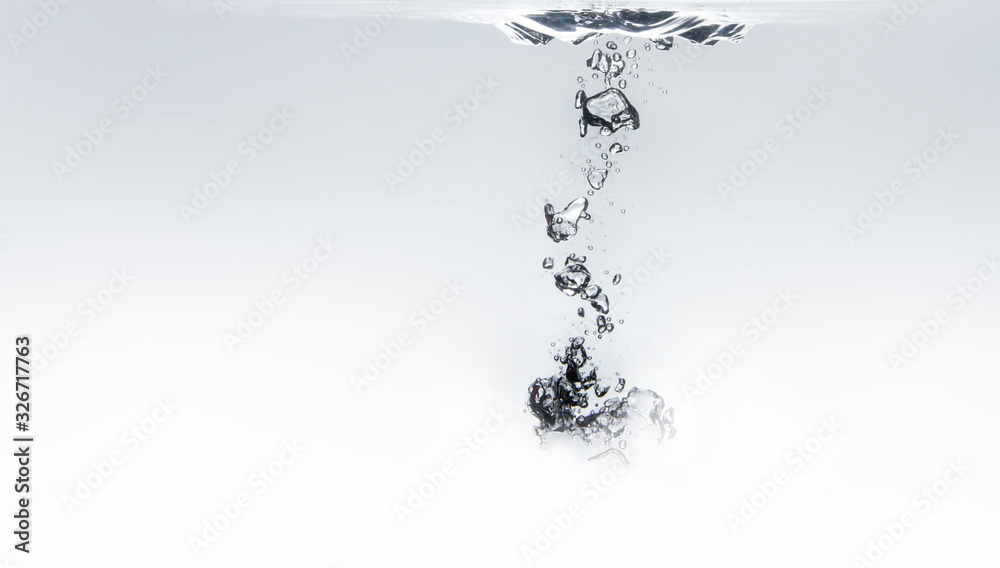 The bubbles formed in the water are grouped together into a lump. White clear water The bubbles formed in the water are grouped together into a lump. White clear water