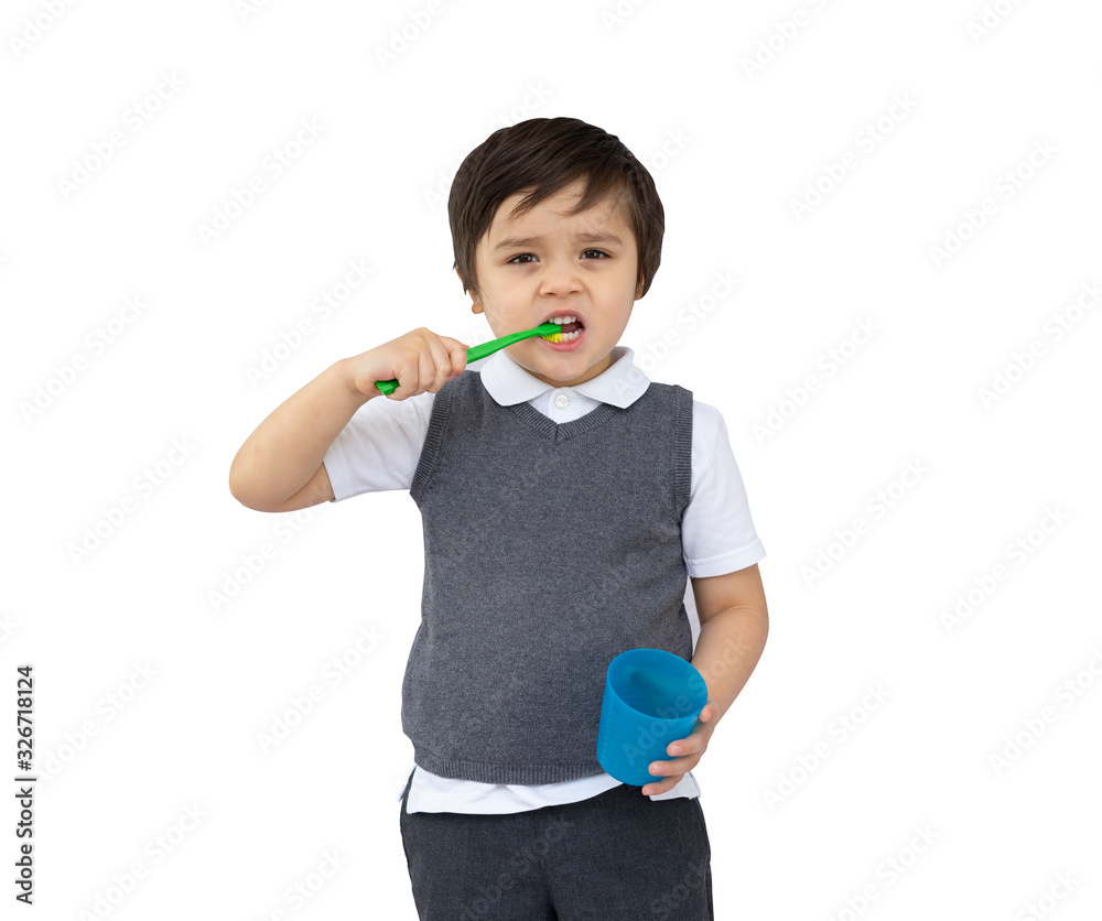 Portrait of Child boy holding toothbrush and blue plastic glass on white background, Isolated on Kid in school uniform learn how to brush his teeth at school,kid development or Dental hygiene concept Portrait of Child boy holding toothbrush and blue plastic glass on white background, Isolated on Kid in school uniform learn how to brush his teeth at school,kid development or Dental hygiene concept