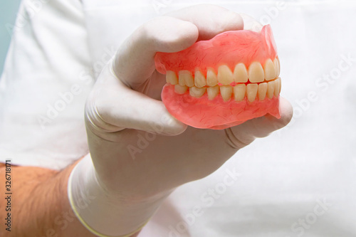 False teeth prosthesis. Doctor Dentist.