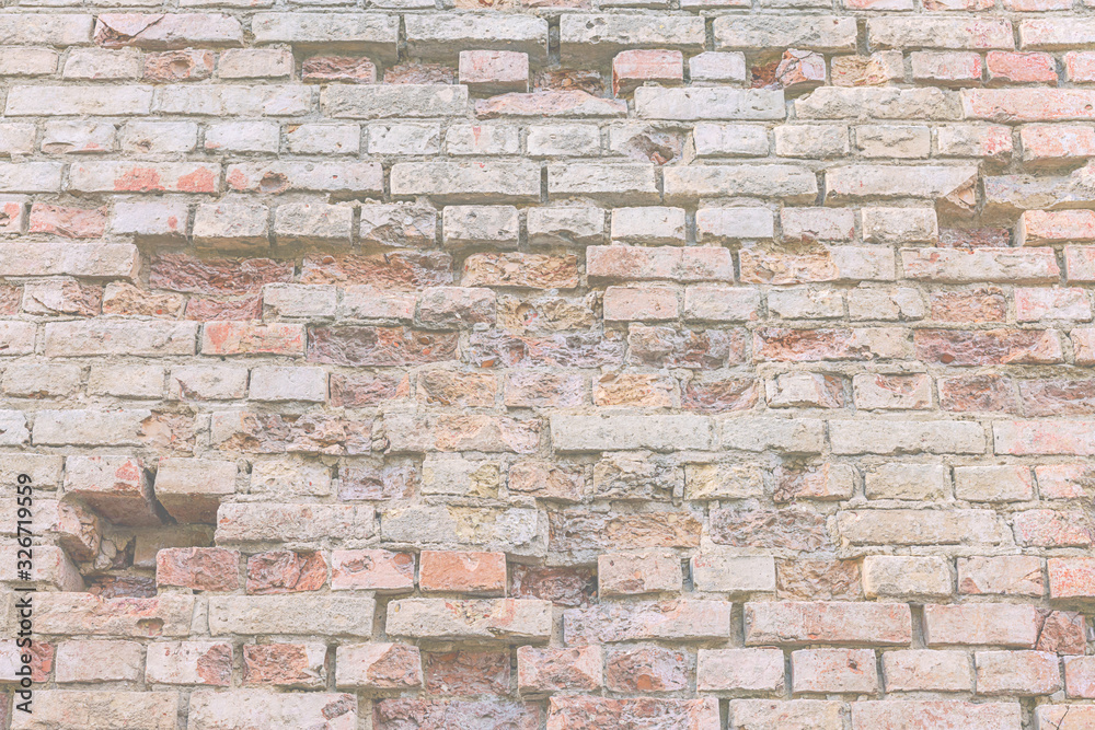 brick wall with holes of abandoned building located in historical city street brick wall with holes of abandoned building located in historical city street