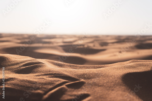 Fototapeta Naklejka Na Ścianę i Meble -  Close up of the sand desert in the middle of hot sunny day. Merzouga, Morocco