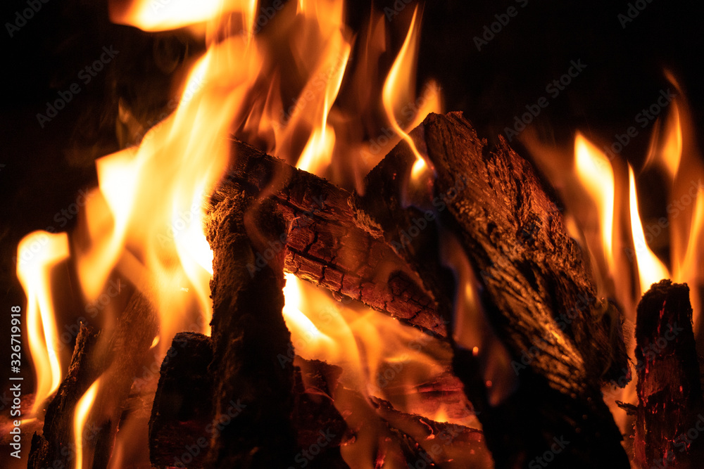 Close up of bonfire. Hot and warm color burning wood on the cold night on the sahara desert, Morocco Close up of bonfire. Hot and warm color burning wood on the cold night on the sahara desert, Morocco