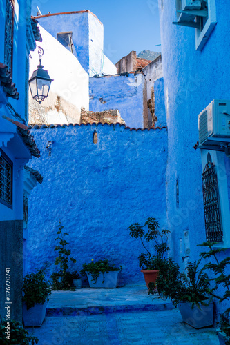 Blue color streets of Chefchaouen in Morocco during warm sunny day in spring time © Lukasz Machowczyk