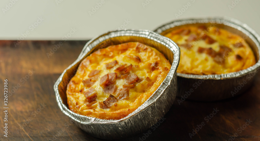 Quiche Lorraine, smoked bacon with medium  and mature cheddar cheese and egg quiche filling in a shortcrust pastry