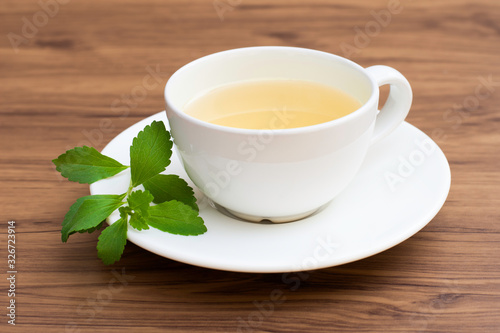 Stevia herbal tea isolated on wood table background.