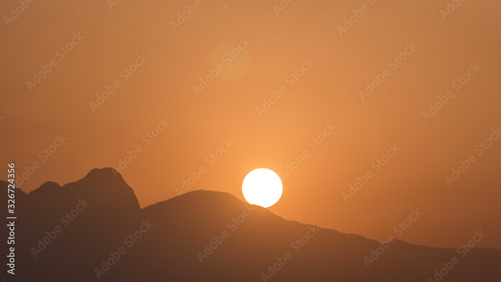 Seascape timelapse of high mountains over clear sunset sky in Antalya, Turkey