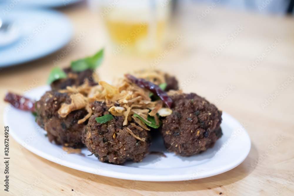 Deep fried spicy minced pork Thai name is Lab Moo Tod