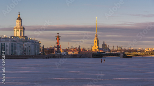 Winter in St. Petersburg. View of the city and the frozen river on a sunny day.