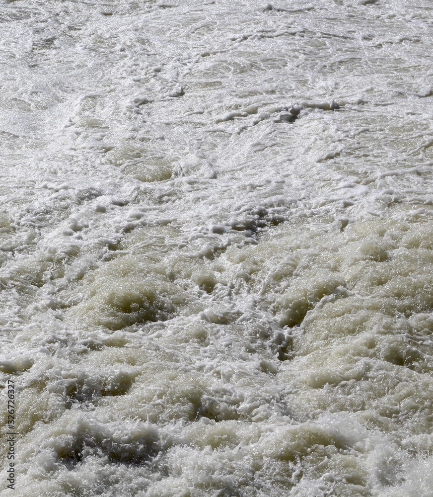 A close view of the fast moving water surface. A close view of the fast moving water surface.