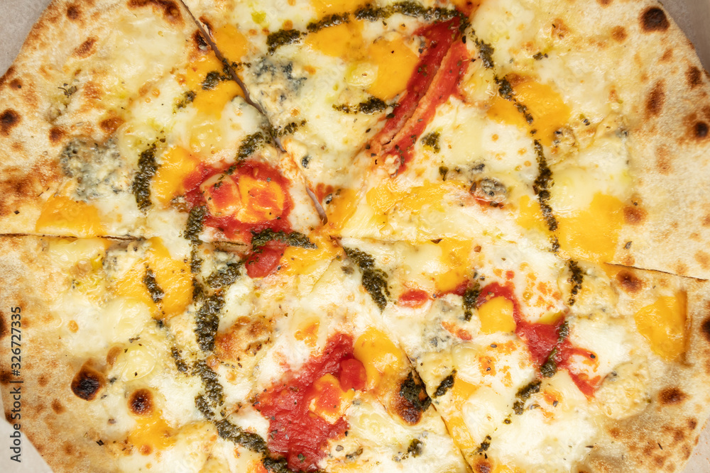 Four Cheese Pizza with Pesto and Tomato Four Cheese Pizza with Pesto and Tomato