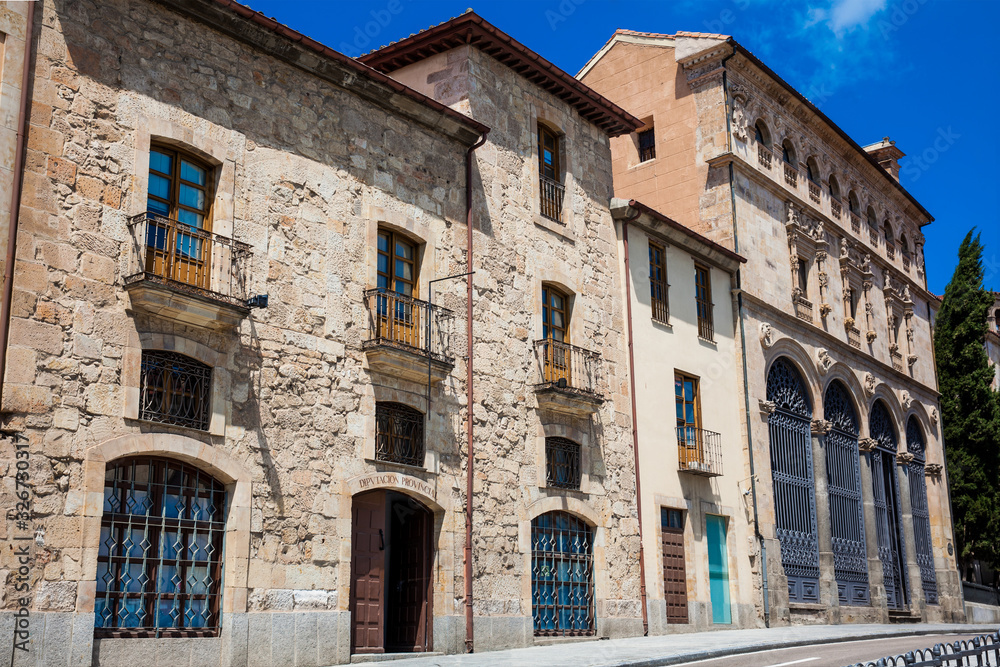 Facade of the beautiful historical buildings located on the San Pablo street in Salamanca city center