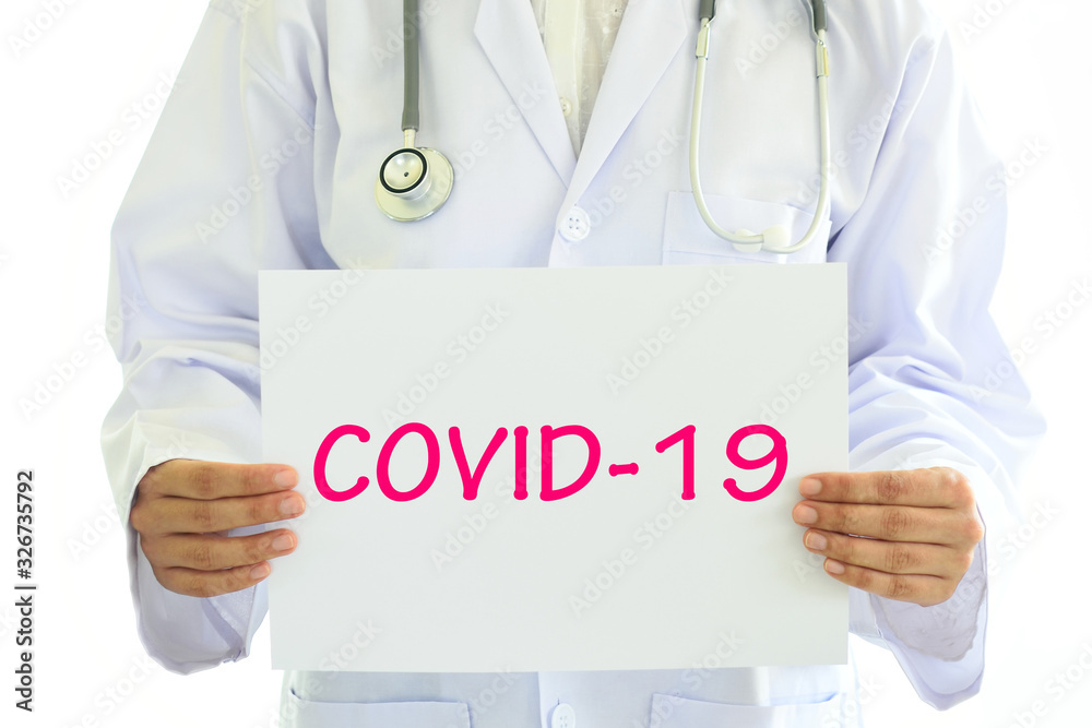 Doctor holding COVID-19 card in hands, medical concept Doctor holding COVID-19 card in hands, medical concept