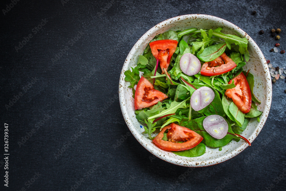 healthy salad tomato, mix leaves, onions and other ingredients, vegan, keto or paleo menu concept. top food background. copy space healthy salad tomato, mix leaves, onions and other ingredients, vegan, keto or paleo menu concept. top food background. copy space