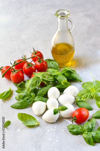 Italian caprese salad. Italy food Ingredients mozzarella buffalo, fresh basil, red tomatoes and olive oil. Italian cuisine, healthy lunch meal. selective focus, copy space