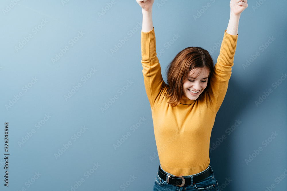 Happy young woman stretching her arms smiling - obrazy, fototapety, plakaty 