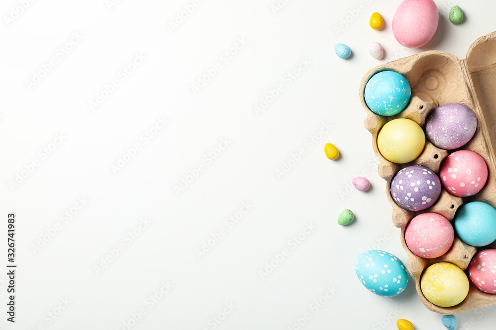Multicolor Easter eggs on white background, top view Multicolor Easter eggs on white background, top view