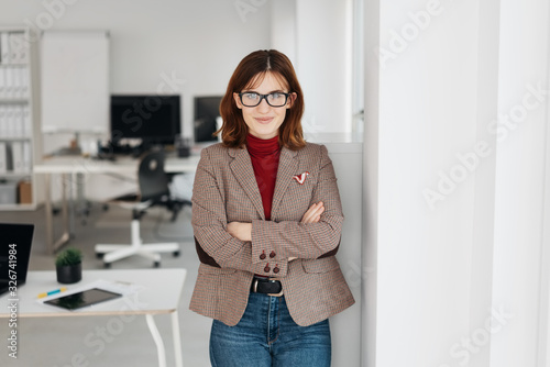 Confident young businesswoman smiling at camera