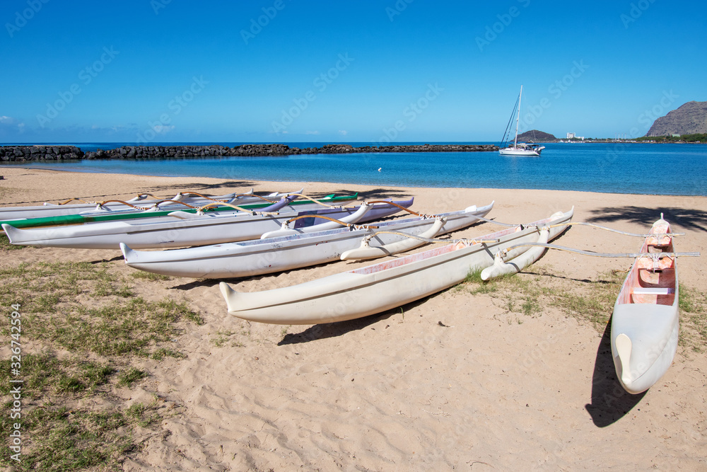 Outrigger canoes on a beach at the west coast of Oahu Hawaii Stock Photo Adobe Stock