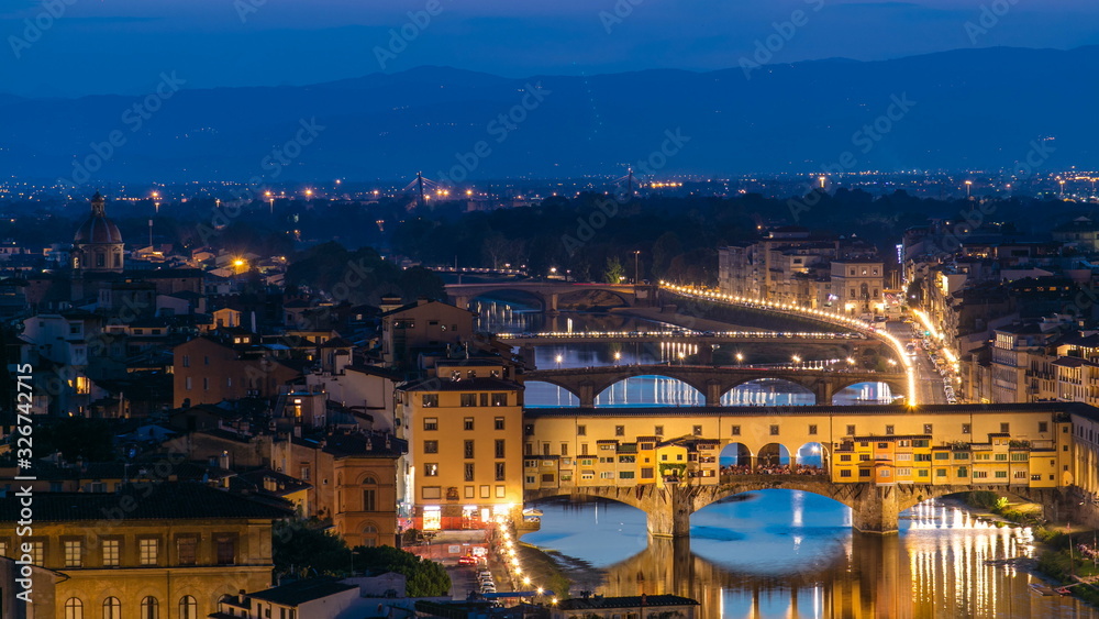 Fototapeta premium Scenic Skyline View of Arno River day to night timelapse, Ponte Vecchio from Piazzale Michelangelo at Sunset, Florence, Italy.