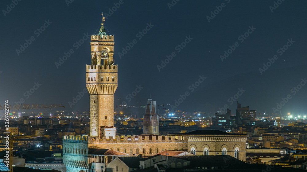 Fototapeta premium Famous Arnolfo tower of Palazzo Vecchio timelapse on the Piazza della Signoria at twilight in Florence, Tuscany, Italy