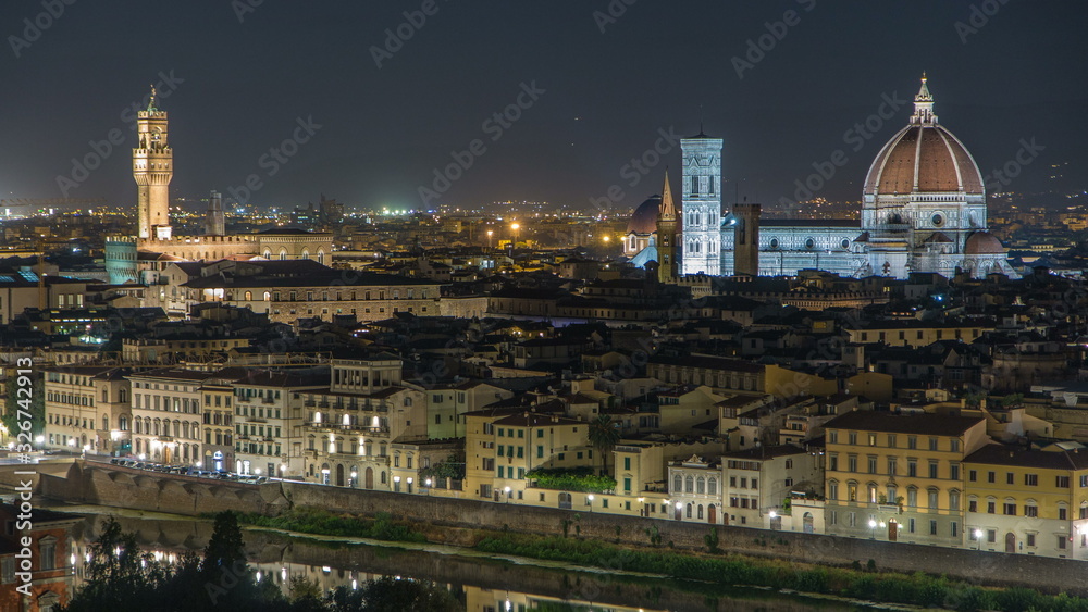 Famous Arnolfo tower of Palazzo Vecchio timelapse and Basilica di Santa Maria del Fiore at night in Florence, Tuscany, Italy