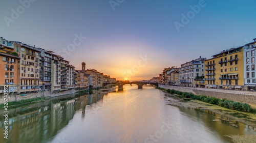 Cityscape view on Arno river with famous Holy Trinity bridge timelapse on the sunset in Florence