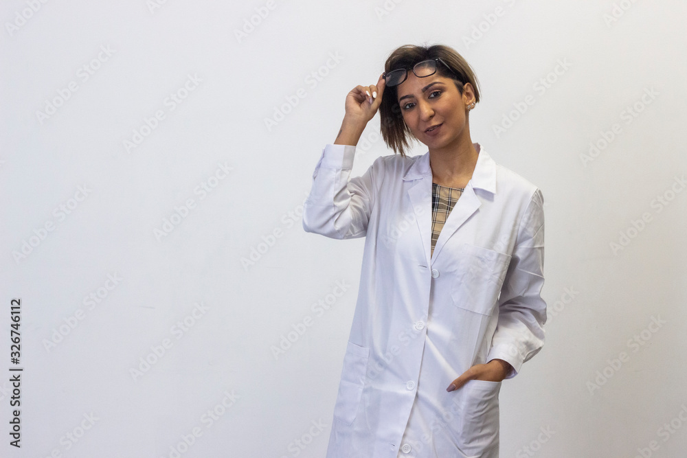 young woman model looks at camera and raising stylish eyeglasses. Pharmacist, therapist, doctor, nurse, veterinarian, ophthalmologist, beautician, healthcare, optometrist, isolated on white background young woman model looks at camera and raising stylish eyeglasses. Pharmacist, therapist, doctor, nurse, veterinarian, ophthalmologist, beautician, healthcare, optometrist, isolated on white background
