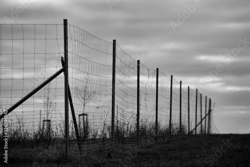 A bleak view of a wire fence along the roadside in Franconia, Germany