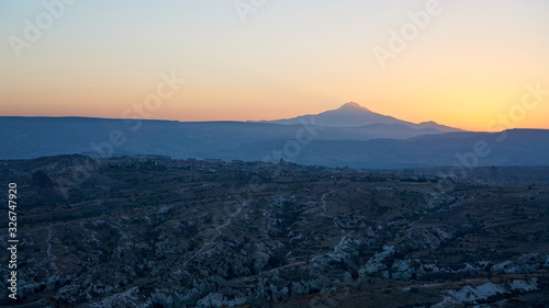 Landscape of the Cappadocia and silhouette of the mountain at sunrise, Central Anatolia, Turkey.