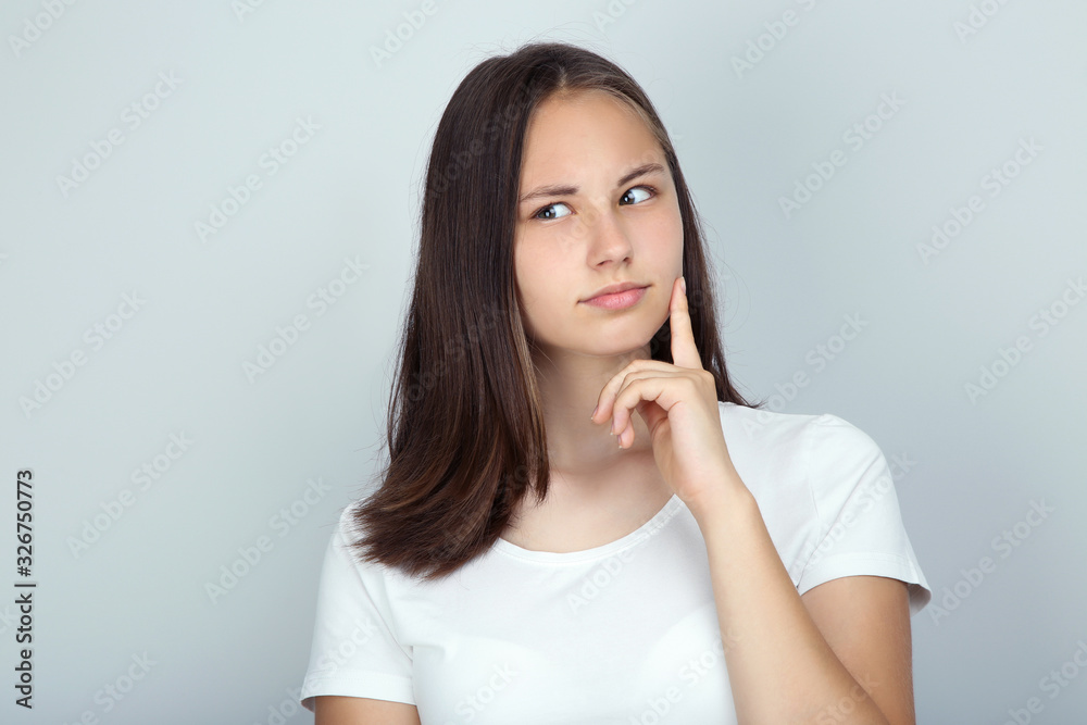 Young beautiful girl on grey background Young beautiful girl on grey background