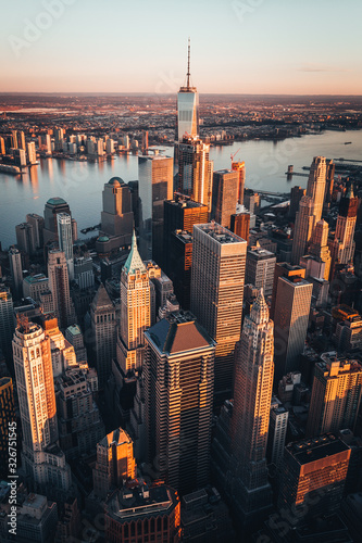 Manhattan Skyline World Trade center at sunrise, beautiful morning glow with warm sun © James