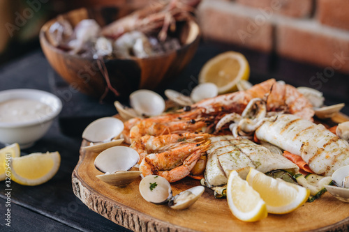 Obraz na płótnie Seafood platter on a black wooden table. Top view w salonie