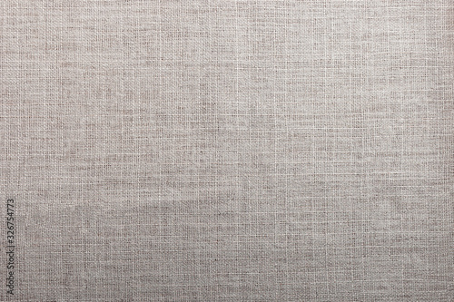 The texture of the cloth of beige. Fabric canvas background.