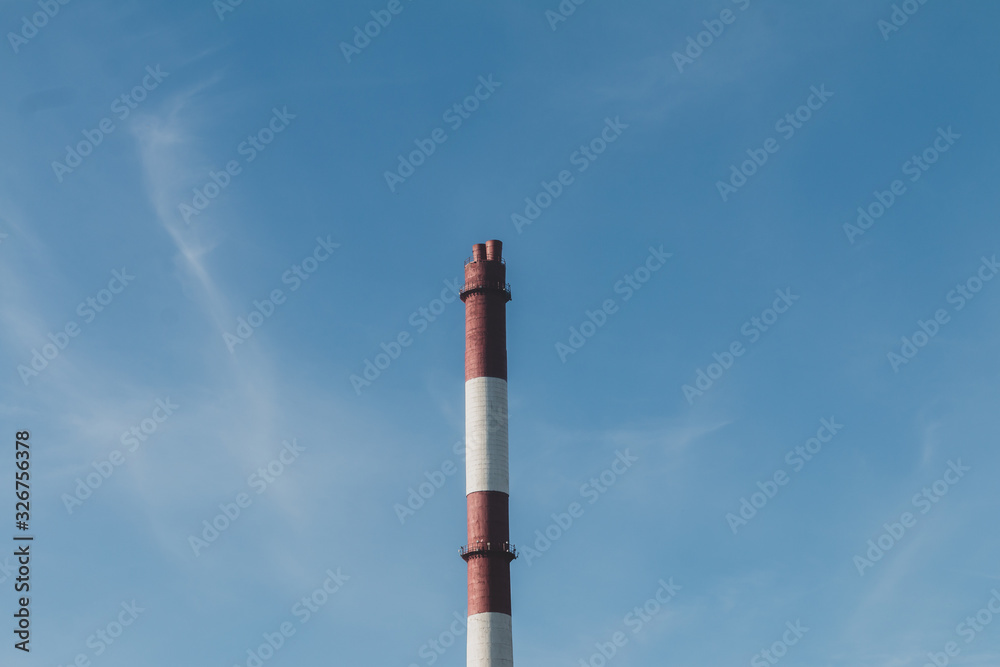 Ecology and climate change concept, pipe on a blue sky. Empty space for text. Ecology and climate change concept, pipe on a blue sky. Empty space for text.