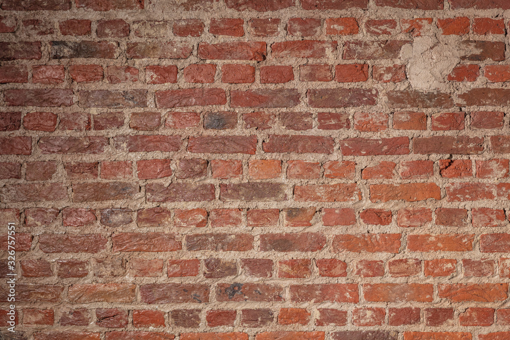 Fototapeta premium Backsteinwand mit grauen Fugen
