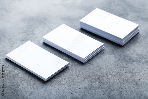 Blank business cards on grey background