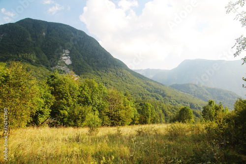 Mountains meadow in Soca river valley, Slovenia photo