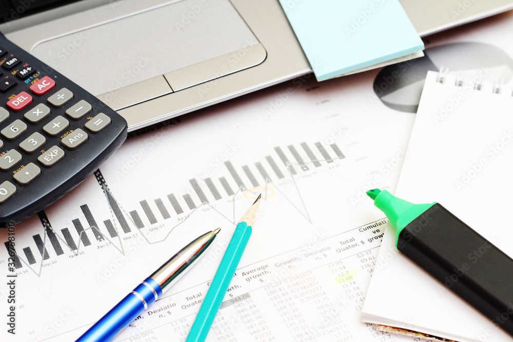Business concept with a report and a calculator Business concept with a report and a calculator