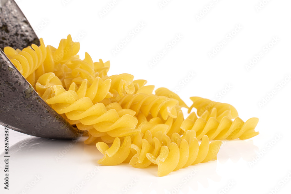 Lot of whole yellow pasta fusilli in glazed bowl isolated on white background Lot of whole yellow pasta fusilli in glazed bowl isolated on white background