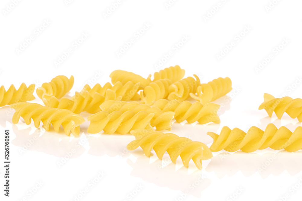 Lot of whole disordered yellow pasta fusilli isolated on white background Lot of whole disordered yellow pasta fusilli isolated on white background