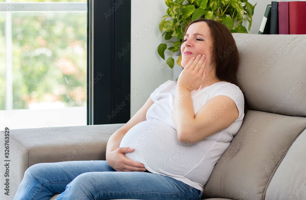 Woman suffering toothache with hand on face Woman suffering toothache with hand on face