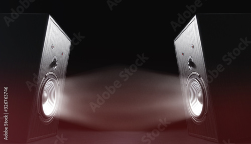 Two sound speakers with funny faces and sound waves on black background.