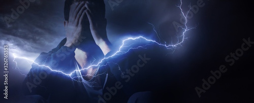 sad men in lightning background