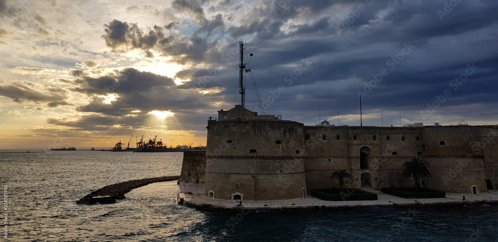 Old medieval Aragonese Castle on sea channel, Taranto, Puglia Apulia , Italy