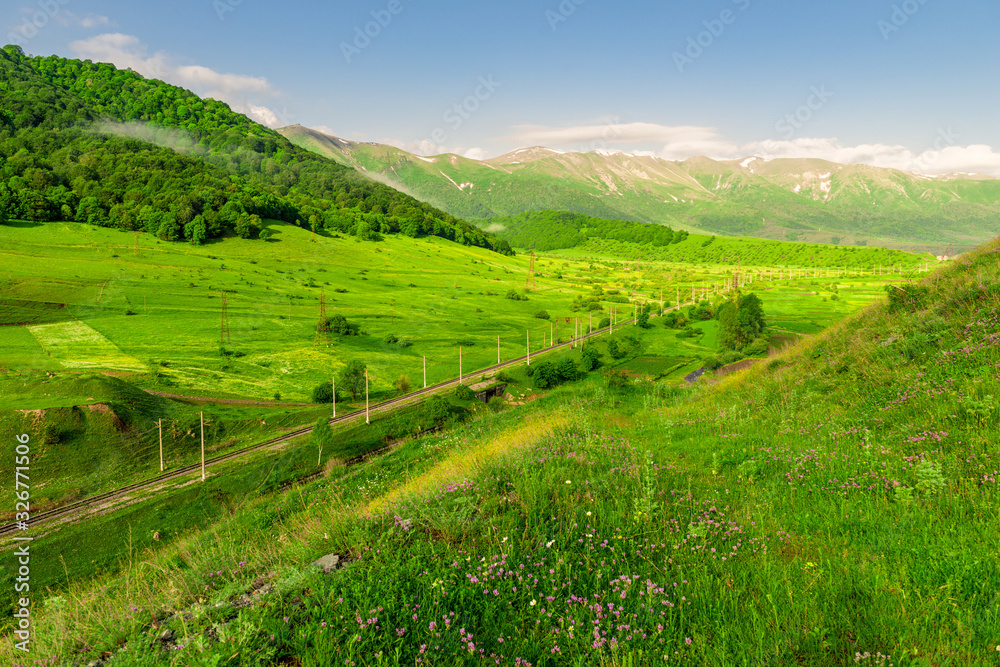 A picturesque mountain valley in Armenia, a view of the snow-capped mountains in the distance